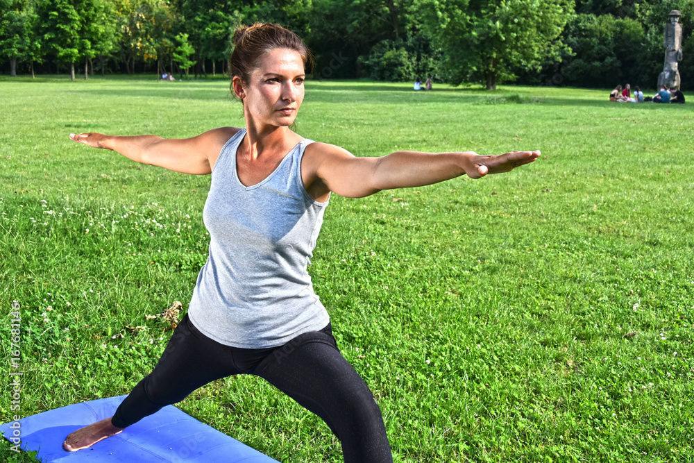 Young woman during yoga meditation in the park Young woman during yoga meditation in the park