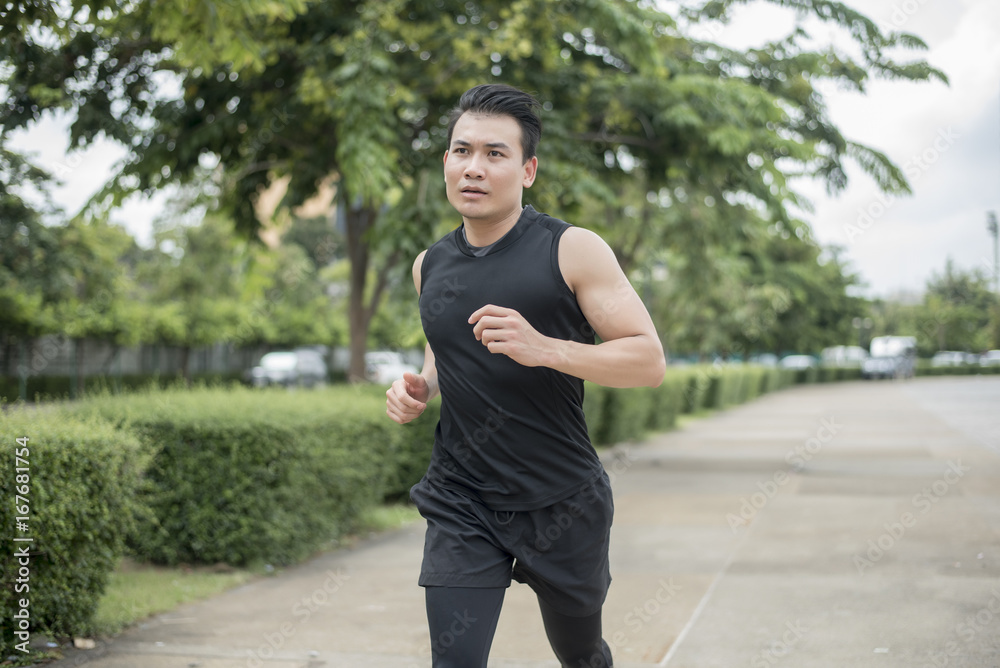 Handsome Sport man running at outdoor city Handsome Sport man running at outdoor city