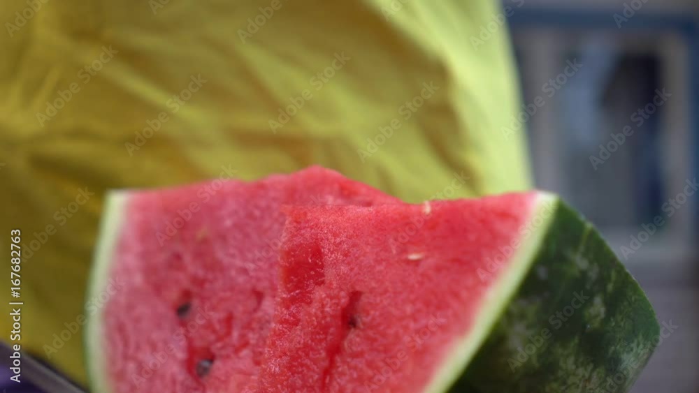 Unrecognizable man cuts watermelon with knife. Countryside. Summer. Unrecognizable man cuts watermelon with knife. Countryside. Summer.