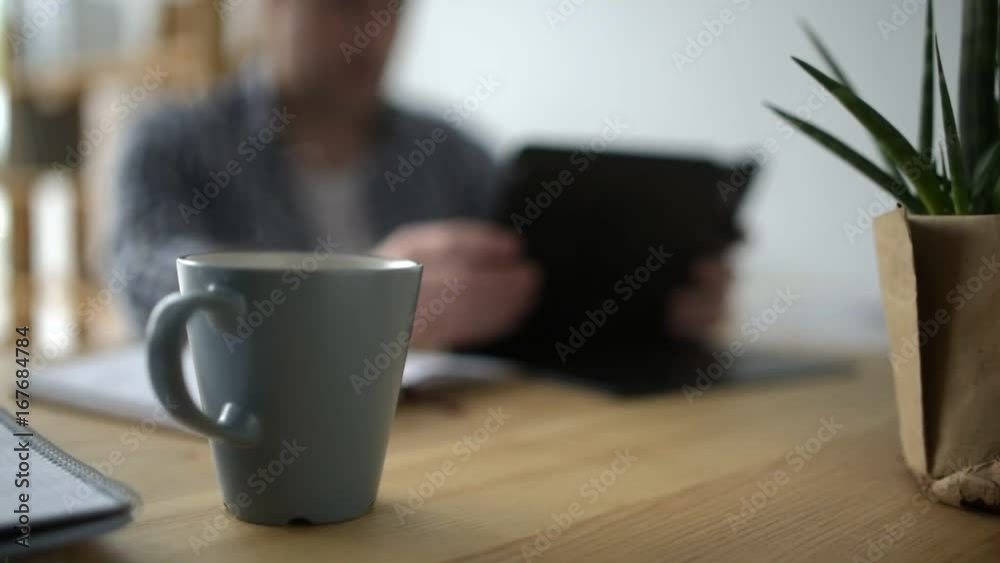 Selective focus of a cup of tea standing on the table