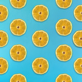 Fruity pattern in flat lay Half of lemon on blue background Top view Trendy colorful flat lay pattern of lemon fruit