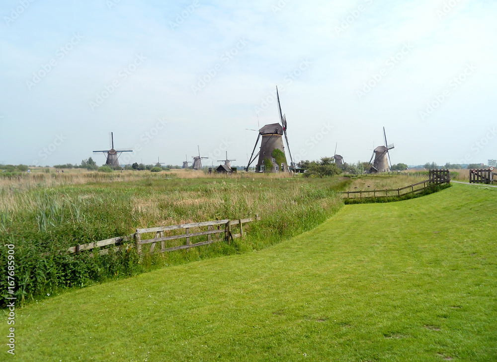 Group of Authentic Dutch Windmills in Kinderdijk Historic Windmill Complex, UNESCO World Heritage Site in Netherlands 
