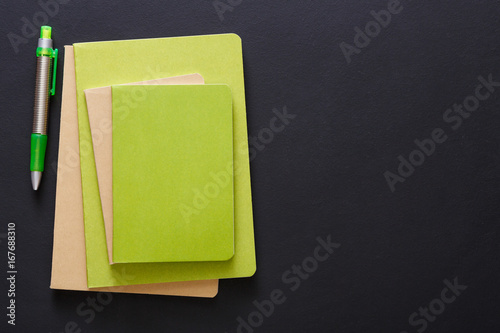Mockup with set of various colorful notebooks