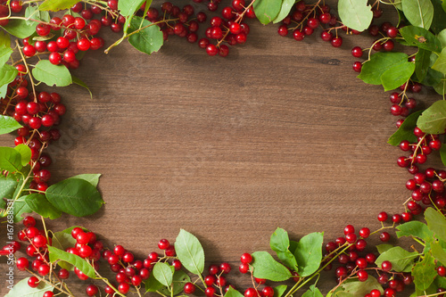Berry on wooden background, dessert, harvest, summer or autumn background