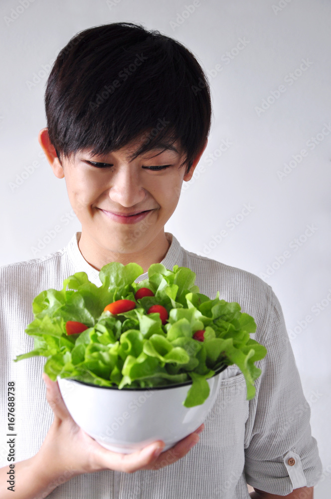 Young Woman Looking at her Salad Bowl