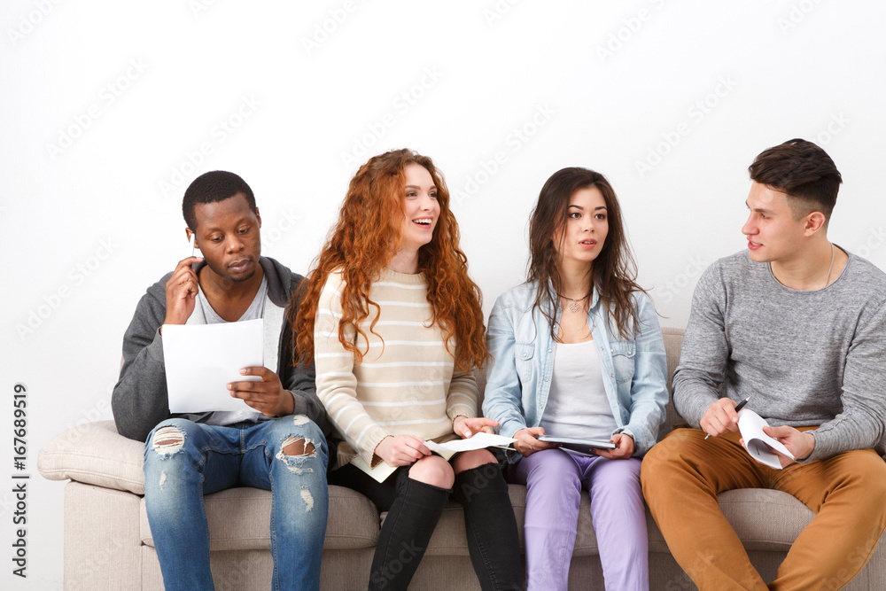 Diverse young students preparing for exam at home Diverse young students preparing for exam at home
