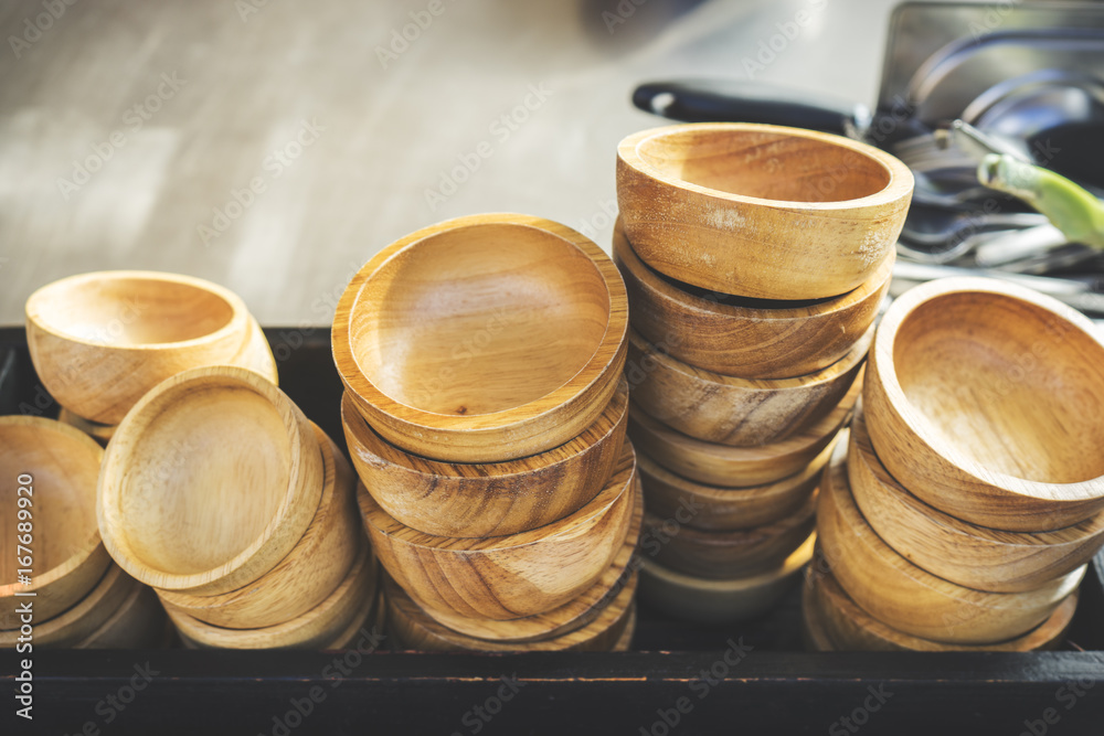 wooden bowls outside a restaurant, store, office or other wooden bowls outside a restaurant, store, office or other