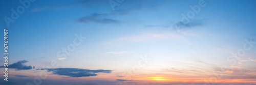 Vibrant color panoramic sun rise and sun set sky with cloud on a cloudy day. Beautiful cirrus cloud. Panorama high resolution photograph. © tanarch