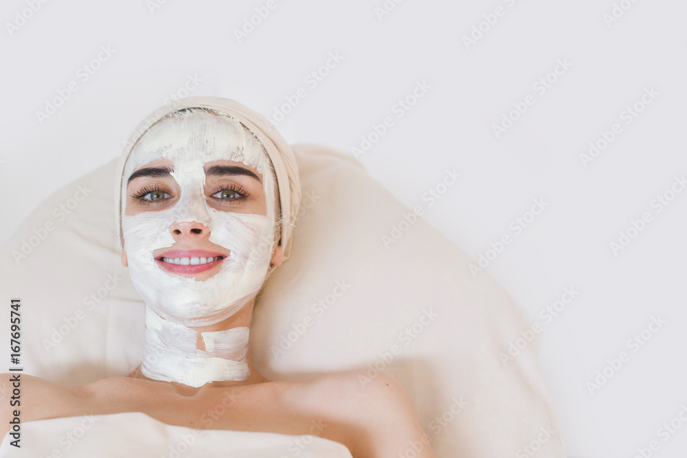 Woman with facial clay mask