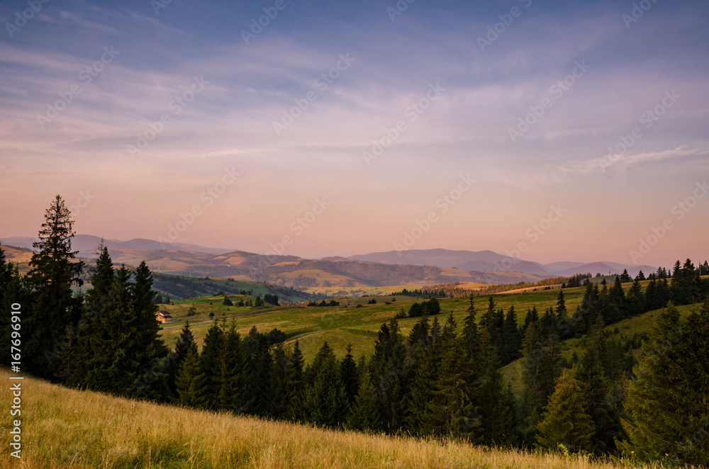 Background with Ukrainian Carpathian Mountains during the sunset in the Pylypets