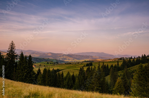 Background with Ukrainian Carpathian Mountains during the sunset in the Pylypets