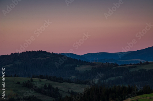 Fototapeta Naklejka Na Ścianę i Meble -  Background with Ukrainian Carpathian Mountains during the sunset in the Pylypets