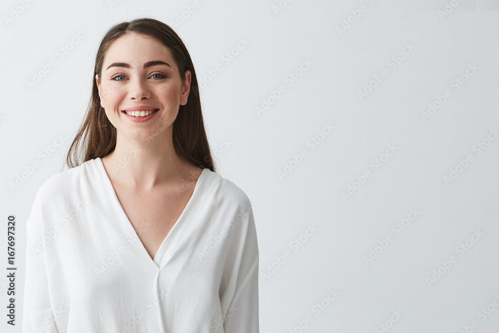 Portrait of happy beautiful young businesswoman smiling looking at camera over white background. Portrait of happy beautiful young businesswoman smiling looking at camera over white background.