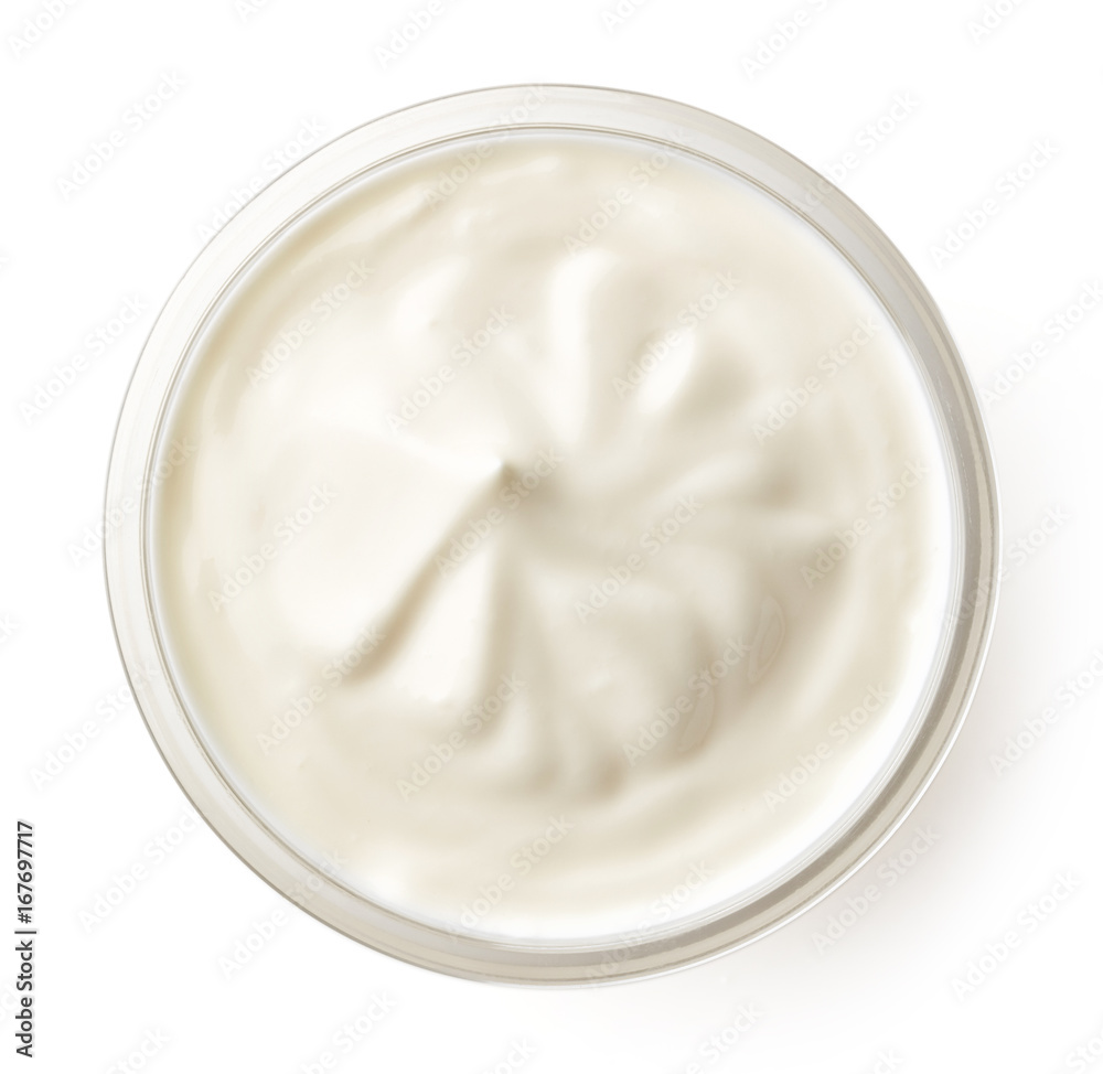 Cream in glass bowl isolated on white, top view Cream in glass bowl isolated on white, top view