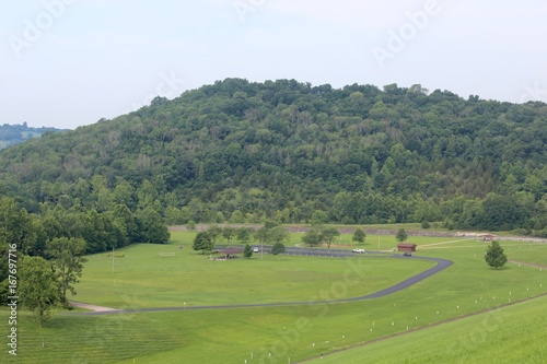The green grass field hill landscape in the park.
