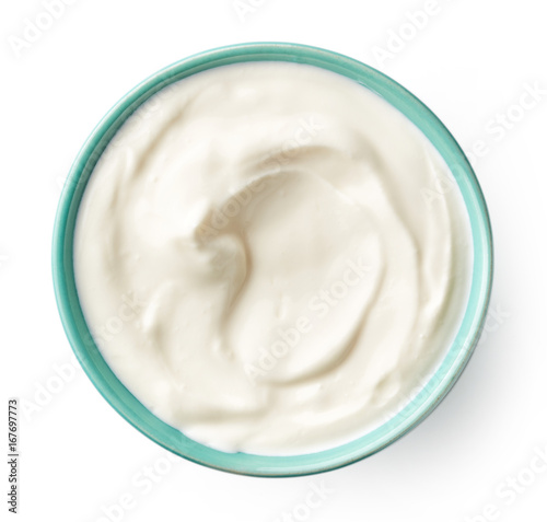 Blue bowl of cream isolated on white, from above