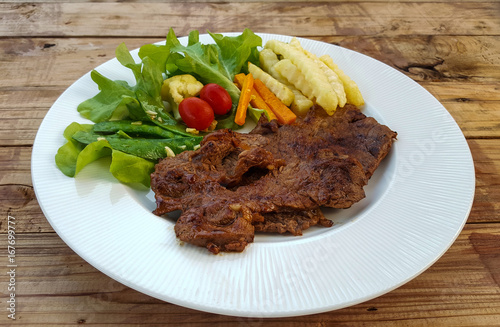 beef steak on wooden background