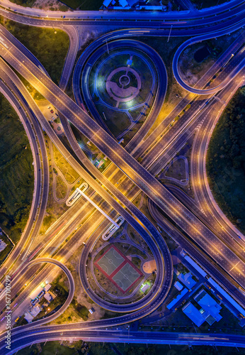 Aerial view, Road roundabout, Expressway with car lots in the city in Thailand. Street large beautiful downtown, cityscape, Top view. © MAGNIFIER