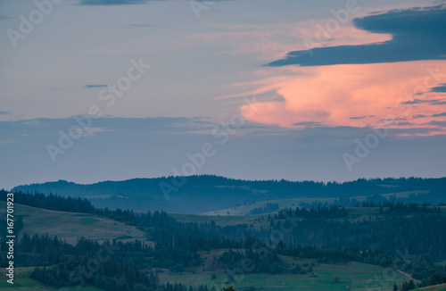 Background with Ukrainian Carpathian Mountains during the sunset in the Pylypets