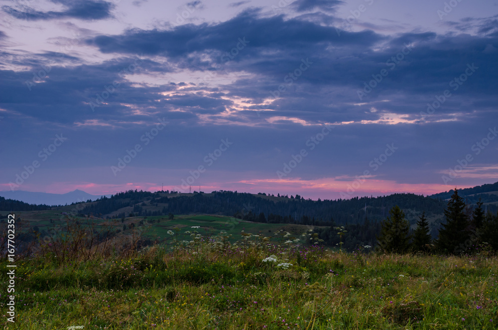 Background with Ukrainian Carpathian Mountains during the sunset in the Pylypets