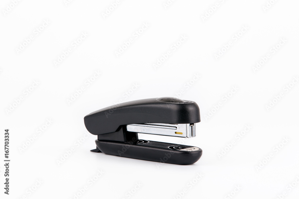 Black stapler isolated on white. Business and education background Black stapler isolated on white. Business and education background