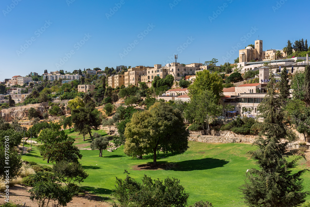 Green urban park and houses in Old Jerusalem.