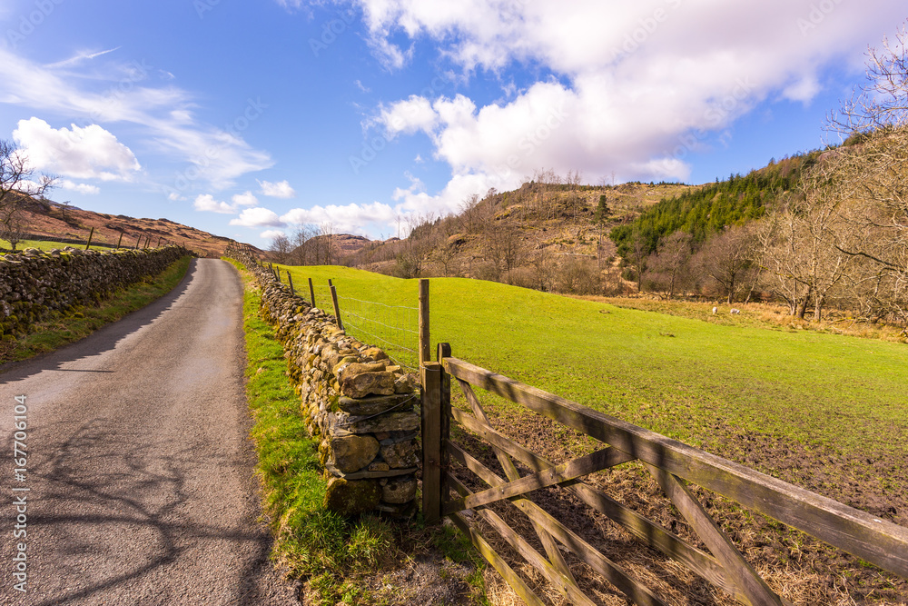 Road through the countryside in The Lake District National Park, Cumbria, England