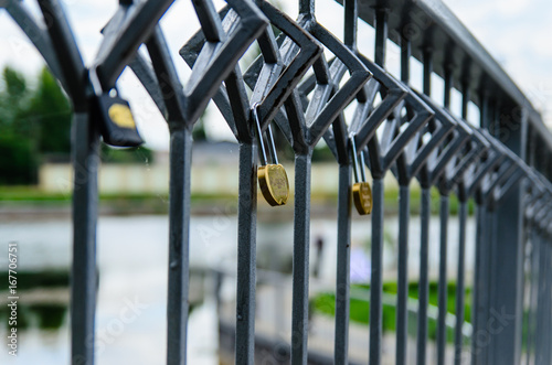 Love padlocks on a bridge in a city park