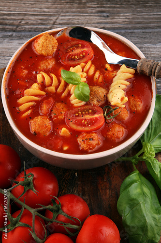 Tomato soup with meatballs in a bowl. Italian minestrone soup