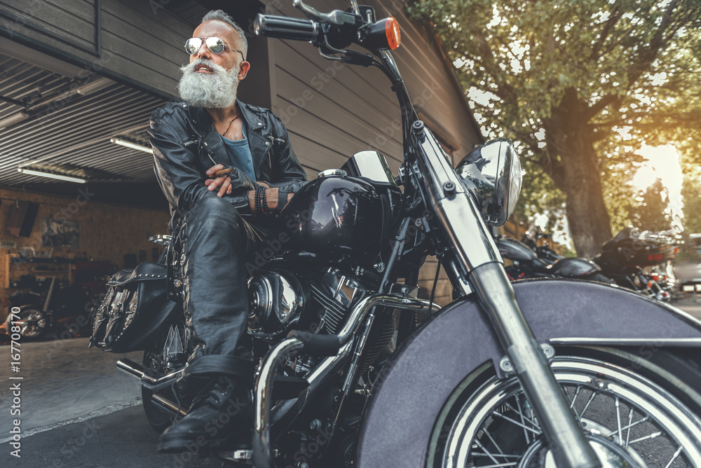 Naklejka premium Happy smiling old male person ready for ride