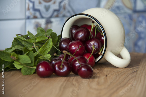 cherry in cup on wooden table