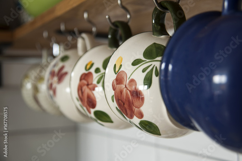 hanging coffee cups in kitchen
