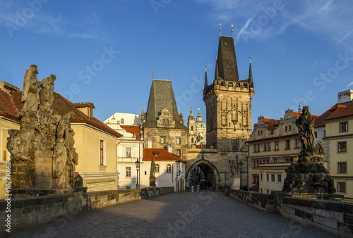 Charles Bridge with its statuette, Lesser Town Bridge Tower and the tower of the Judith Bridge.In the background could see the beautiful Cathedral of St. Nicholas.Prague, Czech Republic.