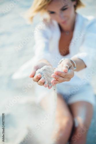 Woman In Relaxation On Tropical Beach with sand , body parts