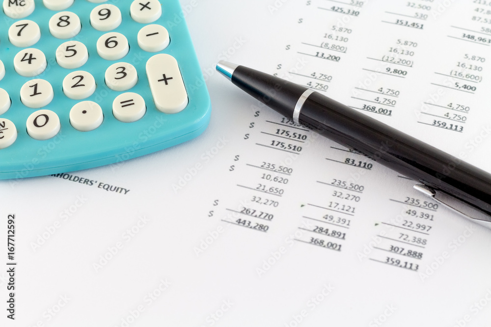 Business Concept: Financial Graph with Calculator financial sheet and black pen Business Concept: Financial Graph with Calculator financial sheet and black pen