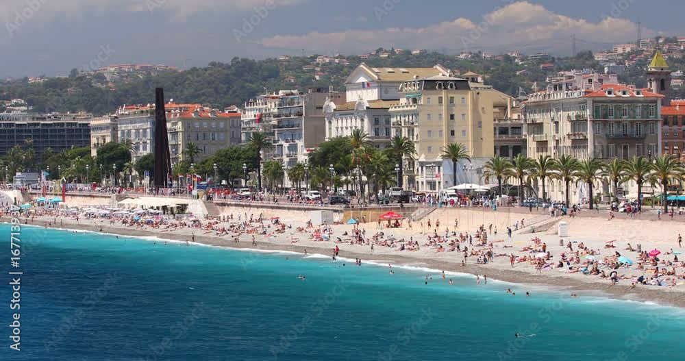 The beach in Nice city with colorful houses and promenade, French riviera, France, Europe.
The beach in Nice city with colorful houses and promenade, French riviera, France, Europe.