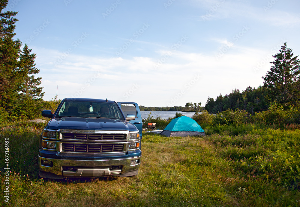 a pickup truck on a campsite - obrazy, fototapety, plakaty 