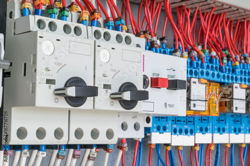 n the electrical control panel are circuit breakers protecting the motor and relay. Circuit breakers with rotary handles and push-button and arranged in a row. Wires with ferrules number coded.