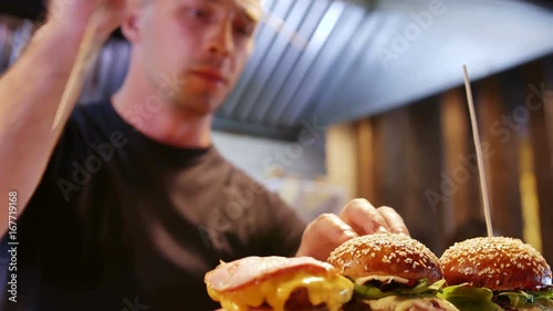 A modern chef prepares delicious American hamburgers