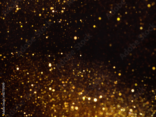 Golden overlay background of golden lights with bokeh effect.
