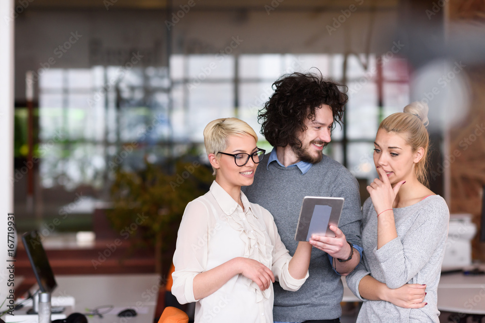 group of Business People Working With Tablet in startup office group of Business People Working With Tablet in startup office