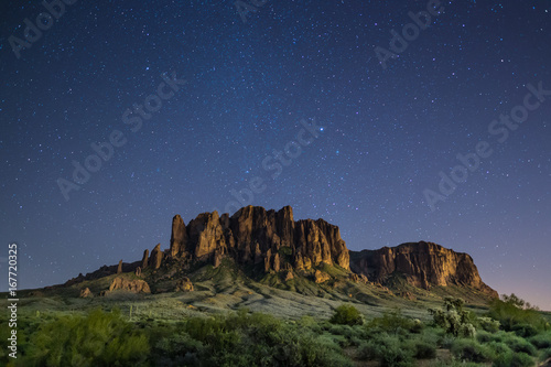 Superstition Mountains in Arizona at night under clear, starry sky
