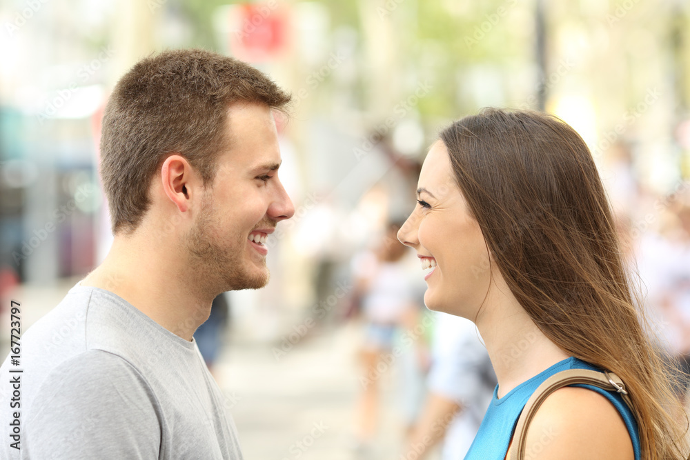 Profile of couple looking each other falling in love