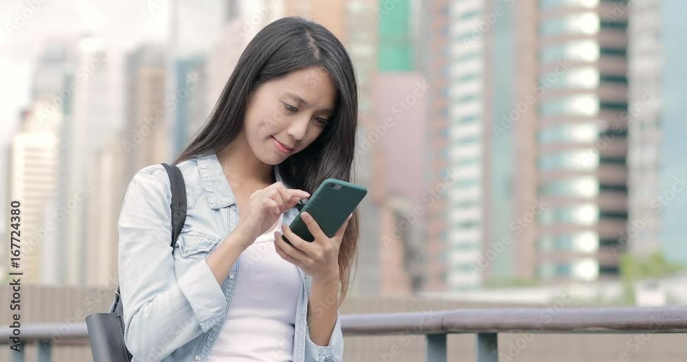 Woman checking something on cellphone Woman checking something on cellphone