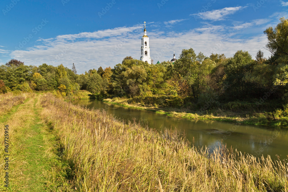 Obraz premium field in the autumn with country church