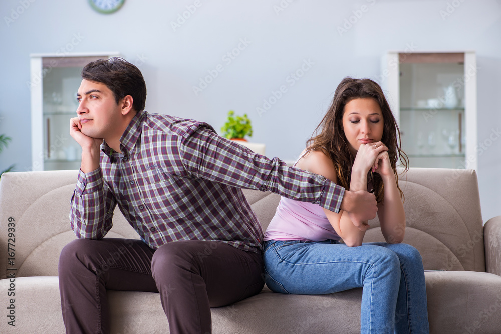 Fototapeta premium Young family in broken relationship concept