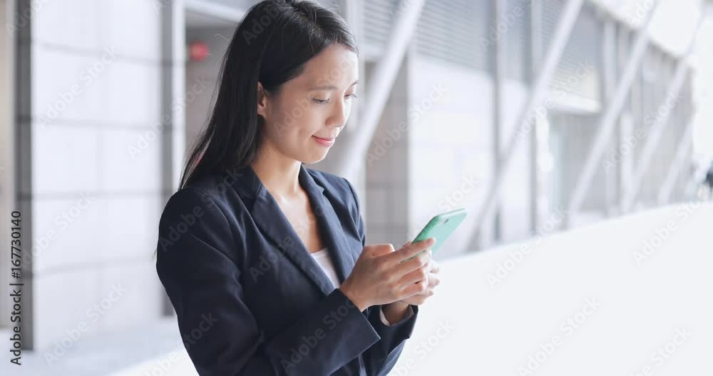 Business woman using mobile phone at outdoor Business woman using mobile phone at outdoor