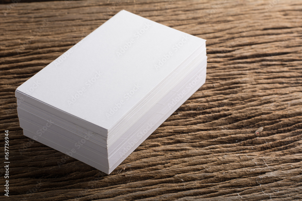 Fototapeta premium Blank white Business card presentation of Corporate identity on wood background