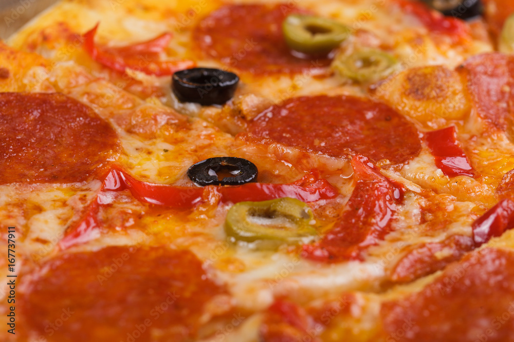 Pizza with sausage and olives. Close up. Pizza with sausage and olives. Close up.