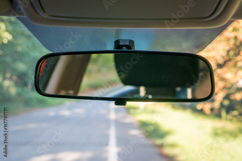 Fotografia Car interior with rear view mirror and windshield
